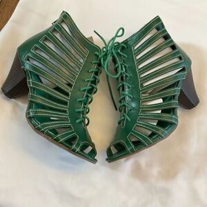 RASOLLI GREEN LACE UP CUT OUT SHOOTIES.  ZIP UP BACK.  NEW IN BOX